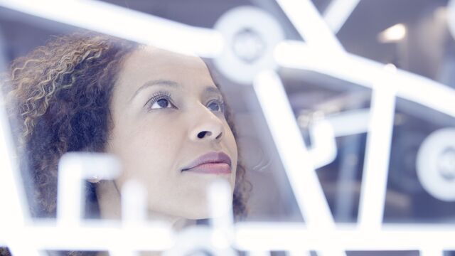 Woman operating digital interface technology - small
